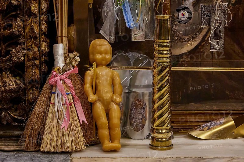 Symbolic objects in a religious context, including doll and broom, framed by gilded decorations, Holy Week, Bay of Panormitis, Panormitis Monastery, Symi, Dodecanese, Greek Islands, Greece