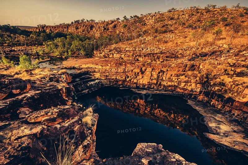 Bell Gorge waterfall, a body of water in north-west Australia in the Kimberley. Sunrise in the outback, Australia