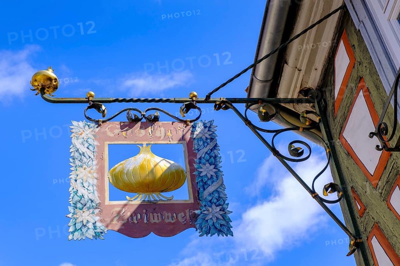 Nose sign, pub sign, onion, Kirchenstraße, half-timbered houses in the old town, Ladenburg, Rhine-Neckar district, Baden-Württemberg, Germany