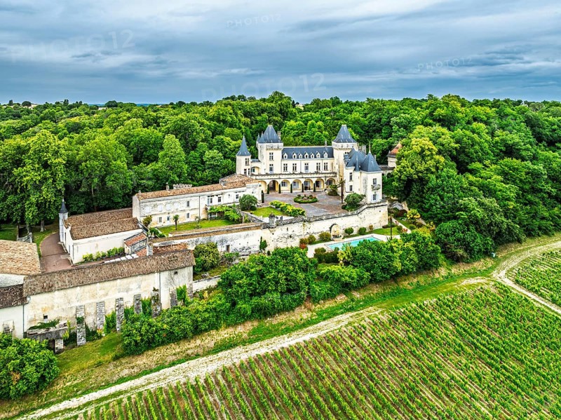 Castle of La Riviere, Vineyard Chateau de La Riviere from a drone, Bordeaux, France