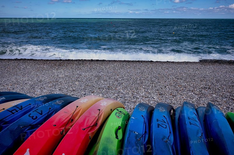 Kayaks, boats, colourful, lying on the beach, pebble beach, Étretat, sea, Normandy, Seine-Maritime, France