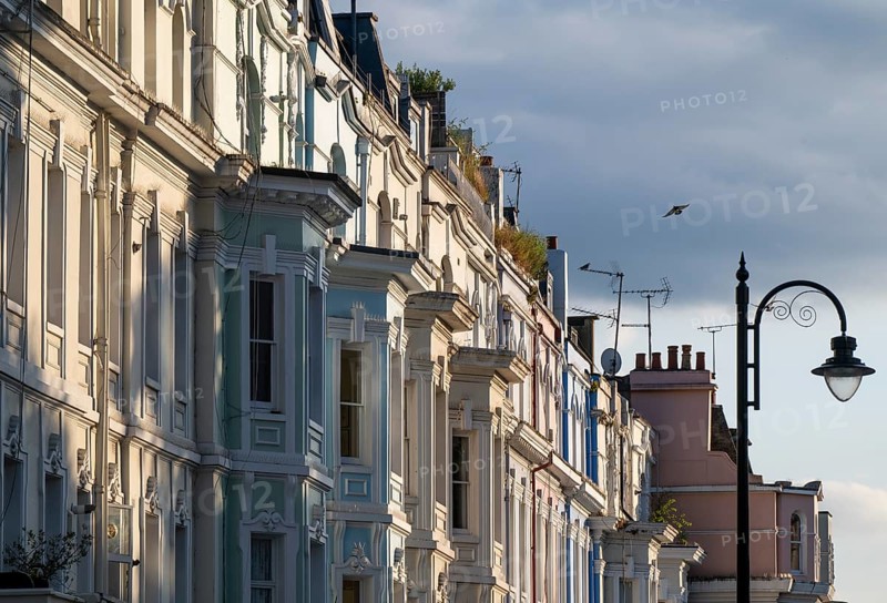 Street lamp, terraced houses, townhouses with different, partly pastel-coloured facades Portobello Road, Notting Hill, London, England, Great Britain