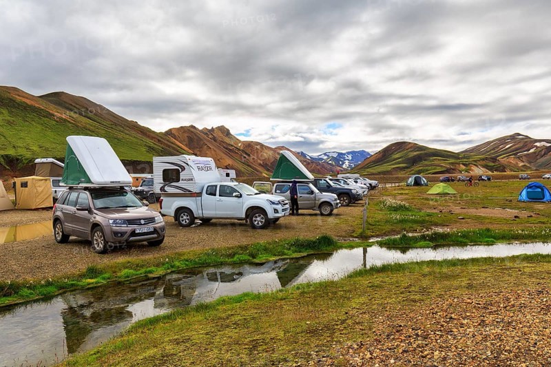 Off-road vehicle with roof tent, camping site in Landmannalaugar, Icelandic highlands, rain clouds, Suðurland, Sudurland, Iceland