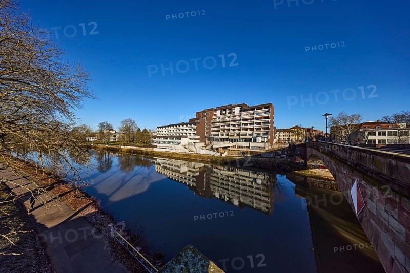 Langwied Foundation, nursing home, modern architecture, concrete architecture, Saar River, symmetrical reflections, water surface, riverbank, car and pedestrian bridge, footpath and cycle path, lantern, blue sky, cloudless, Bismarck Bridge, Saarbrücken, state capital, Saarbrücken Regional Association, Saarland, Germany