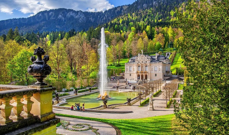 Water parterre with large fountain and portal of Linderhof Castle in spring, municipality of Ettal, Ammergau Alps, Ammertal, Upper Bavaria, Bavaria, Germany