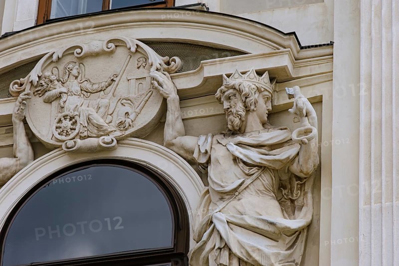 Jupiter and Janus holding a relief of Fortuna, sculptural relief on the façade of St Michael's Wing in the inner courtyard of the Vienna Hofburg Imperial Palace, Vienna, Austria, for editorial use only