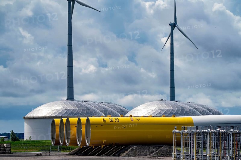 The seaport of Eemshaven, Julianahaven Basin, where the foundation structures, monopiles, for offshore wind farms are stored, which then support the actual wind turbines, the components are transported to the wind farms in the North Sea on large workboats and anchored to the seabed, where the wind turbines are then built, Eemshaven, Netherlands