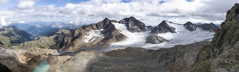 Panorama from the summit of the Becher, high mountain landscape, view of mountain peaks Königshofspitz and Schwarzwandspitz with glacier of the Übeltalferner, view of the Ridnaun valley, Stubai Alps, South Tyrol, Italy