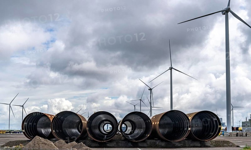 The seaport of Eemshaven, Julianahaven Basin, where the foundation structures, monopiles, for offshore wind farms are stored, which then support the actual wind turbines, the components are transported to the wind farms in the North Sea on large workboats and anchored to the seabed, where the wind turbines are then built, Eemshaven, Netherlands