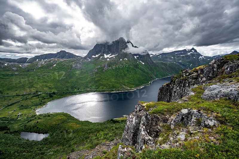 View of Mefjorden fjord from Barden mountain, Breidtind mountain peak behind, Senja, Norway