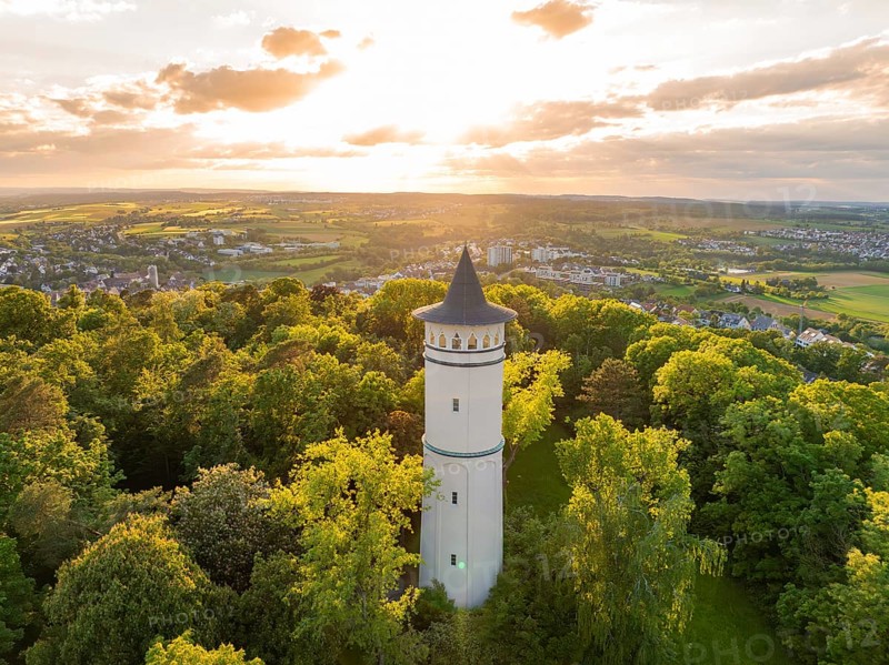 In the sunset light, a tower rises above the blossoming scenery, Engelberg Tower, Leonberg, Germany