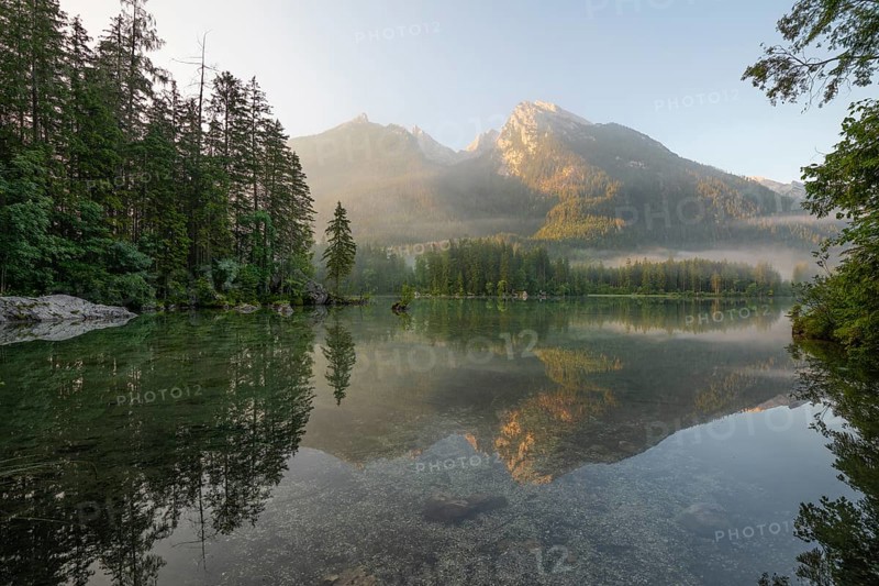 Magical sunrise with fog at Hintersee near Ramsau in Berchtesgadener Land