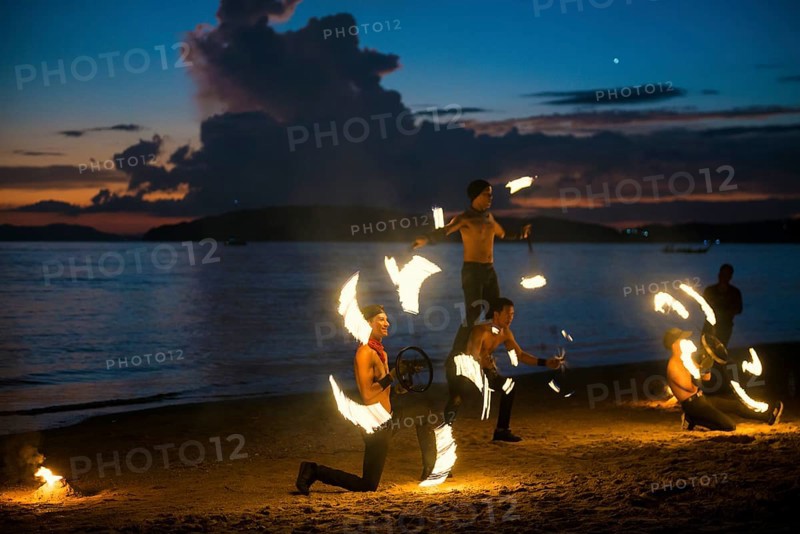 Fire show, jugglers with fire, Ao Nang Beach, sunset, Ao Nang, Krabi, Thailand