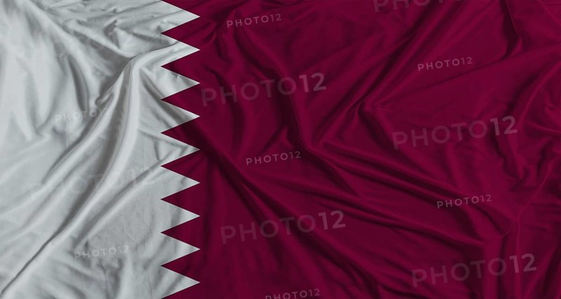 Qatari flag with fabric texture background. National flag of Qatar with cloth texture