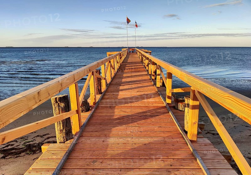 New south beach bridge at atmospheric sunrise with a view of Amrum, Südstrand, Wyk auf Föhr, North Frisia, Germany