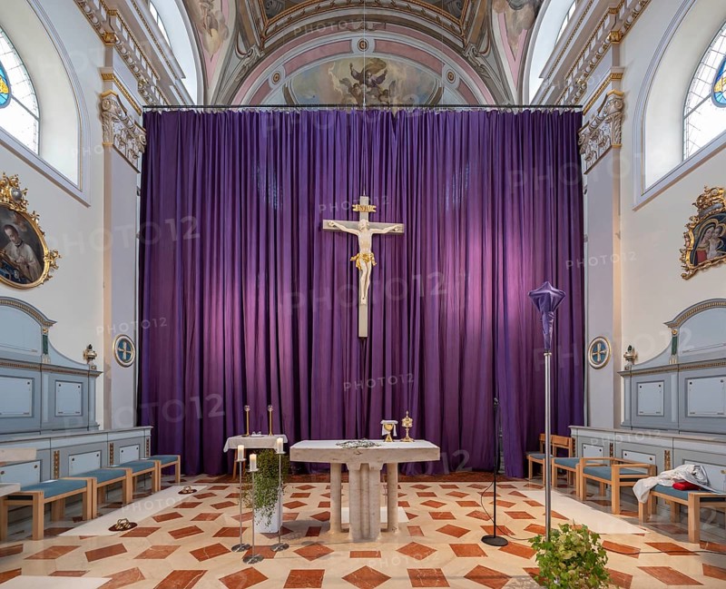 Large purple Lenten cloth in front of the high altar in the baroque parish church of St Nicholas, built between 1722 and 1724, Kirchacker 20, Tannheim, Austria