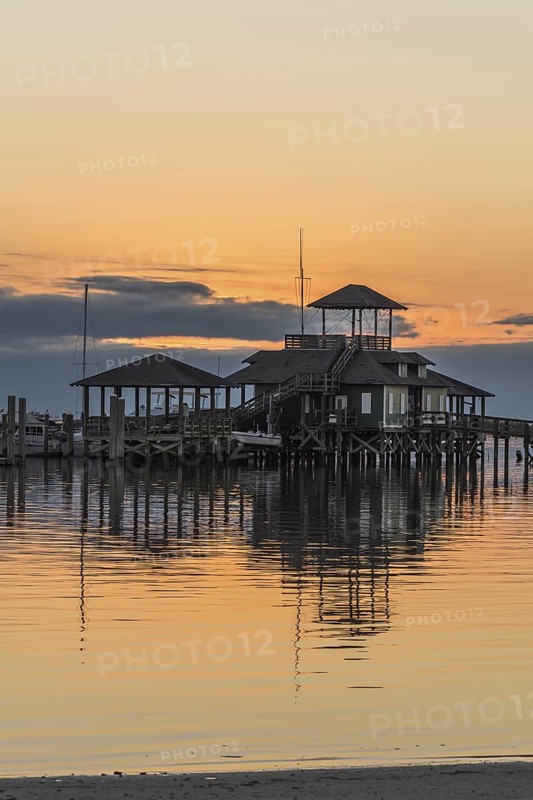 Biloxi Schooner Pier Complex at sunset on the Gulf of Mexico at Biloxi, Mississippi, USA