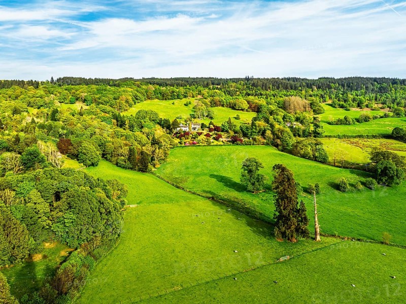 Farms over Coniston Water from drone, Lake District National Park, Cumbria, UK