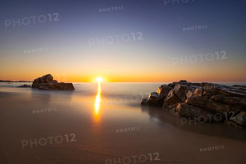 The sun rises on the Costa Rei, a stretch of coastline on the Italian Mediterranean island of Sardinia, Monte Nai, Costa Rei, Sardinia, Italy
