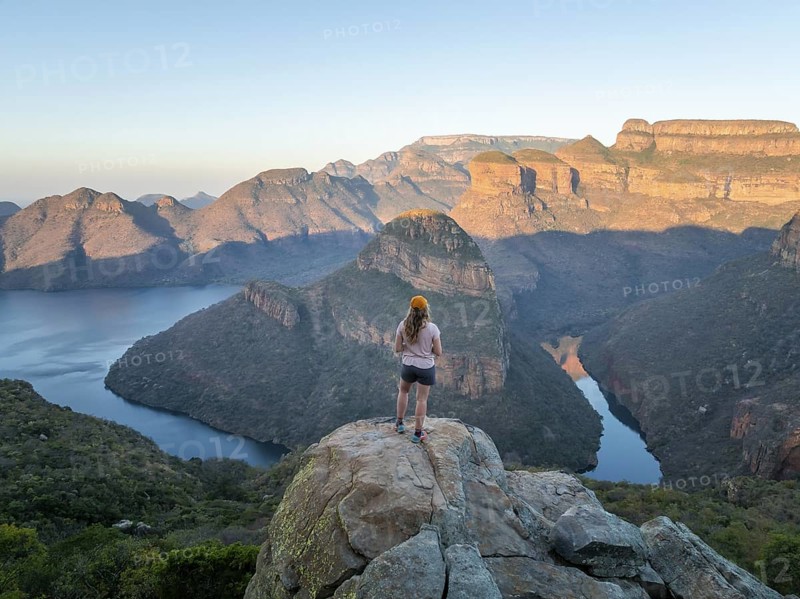 Hiker enjoying panorama, Blyde River Canyon with summit Three Rondawels, view of canyon with river Blyde River and table mountains, canyon landscape, Panorama Route, Mpumalanga, South Africa