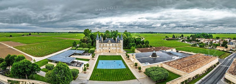 Panorama of Chateau Pichon Longueville Baron Vineyard and grape fields around Pauillac from a drone, Bordeaux, Gironde, Nouvelle-Aquitaine, France