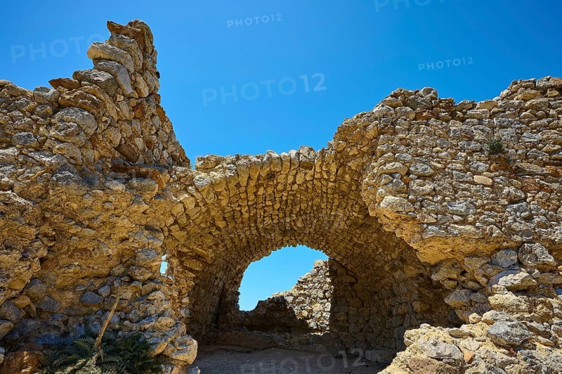 Ancient stone arch under a clear blue sky, Abandoned village, Lost place, Pyli, Paleo Pyli, Byzantine fortress, Kos, Dodecanese, Greek Islands, Greece