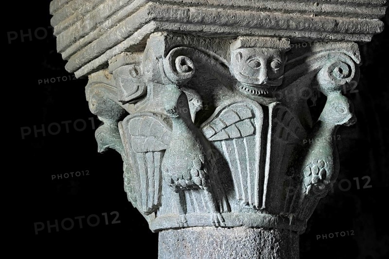 Column capital with dove, relief in stone, underground grove of columns, pagan crypt, 10th century, gloomy illumination, Cathedral of Acquapendente, Basilica of the Holy Sepulchre, Basilica Santo Sepolcro, Basilica minor, Aquapendente, Province of Viterbo, Lazio, Italy