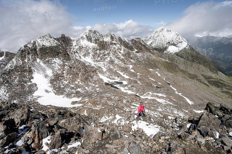 Mountaineers in a rocky mountain landscape, ascent to the Keeskopf from the Niedere Gradenscharte, behind the summit of the Kleiner Hornkopf, Schober group, Hohe Tauern National Park, Carinthia, Austria