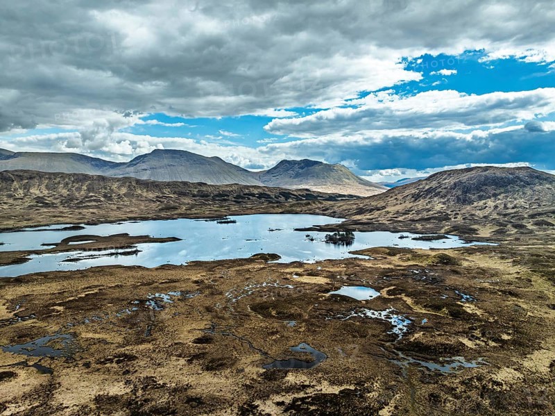 Rannoch Moor from a drone over Loch Ba and Loch of the Armpit, A82 Highland Way, Argyll and Bute, West Highlands, Scotland, United Kingdom