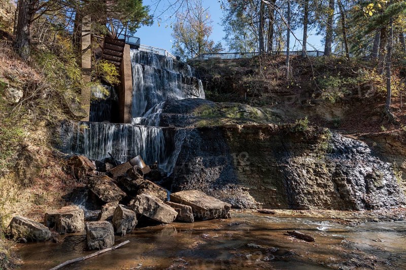Water diverted from nearby Chunky River to this man-made waterfall to power a grist and cotton mill at Dunn's Falls Park near Enterprise, Mississippi, USA