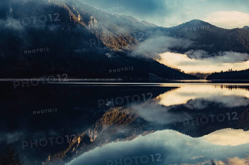 Sunrise with reflections in the Plansee in Tyrol in the Alps in Austria