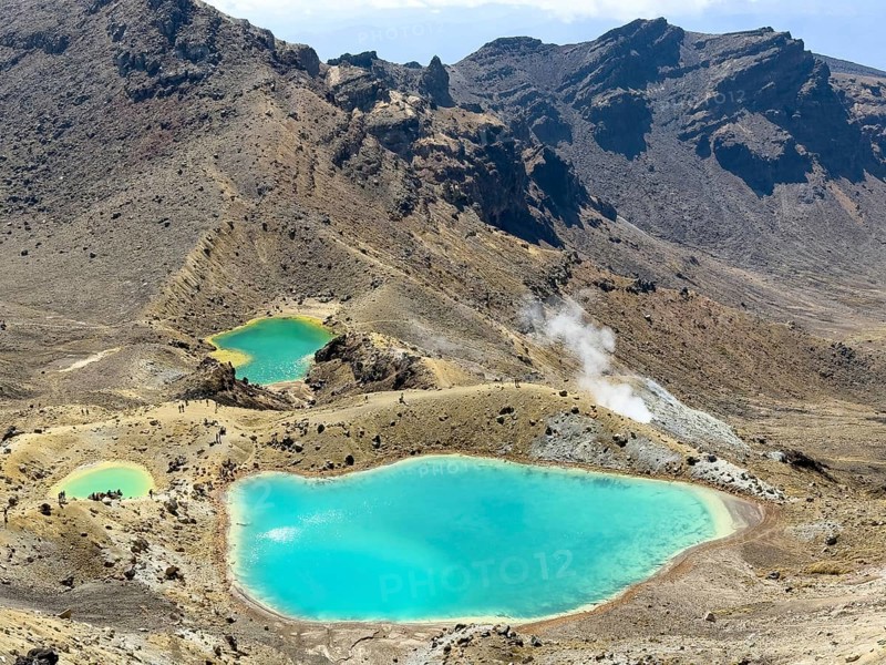 On the hiking trail of the Tongariro Alpine Crossing in Tongariro National Park with a view of the Emerald Lakes, North Island, New Zealand, Oceania