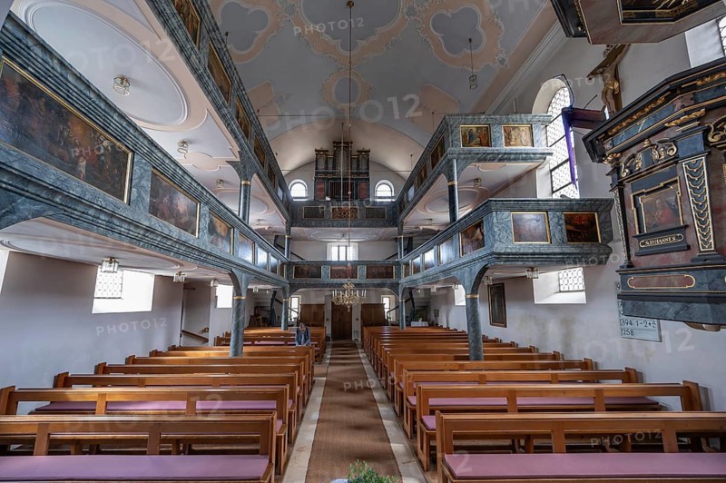Interior with organ gallery and surrounding double galleries, historic Evangelical Lutheran fortified church of St Nicholas, Offenhausen, Middle Franconia, Bavaria, Germany