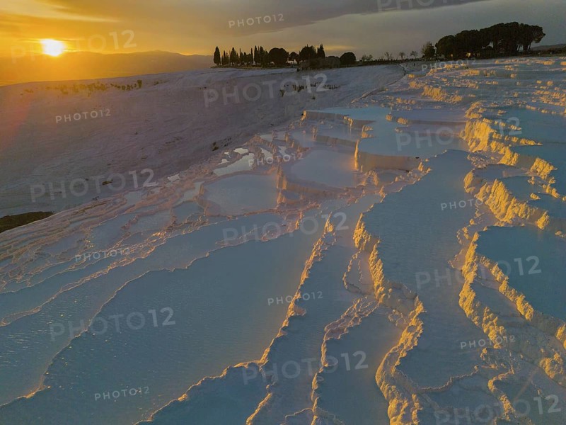 Twilight with illuminated terraces and reflecting water, surrounded by natural beauty, aerial view, sinter terraces, limestone sinter terraces, travertine terraces, Pamukkale, Denizli, UNESCO World Heritage Site, Anatolia, Turkey