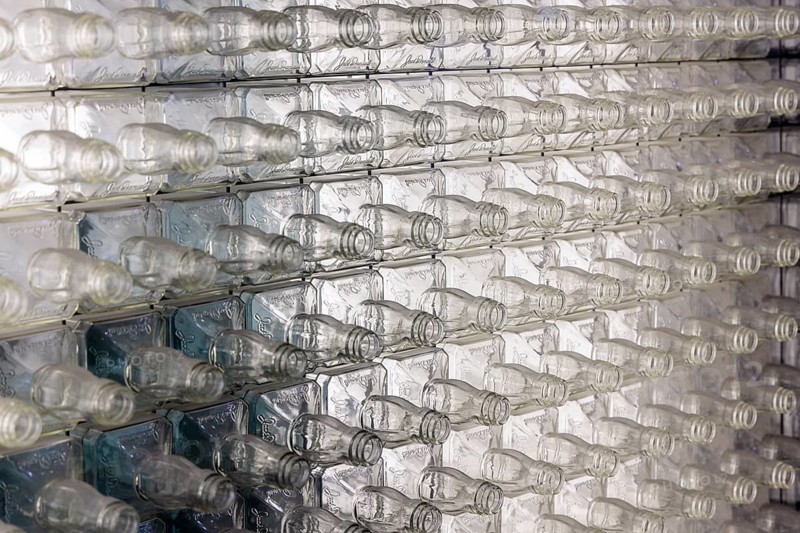 Wall of empty glass whiskey bottles at the Visitor Center of the Jack Daniel Distillery in Lynchburg, Tennessee