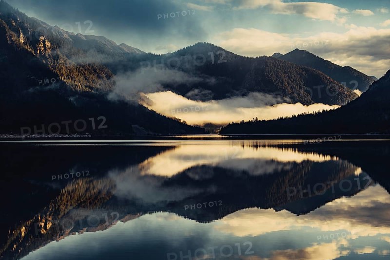 Sunrise with reflections in the Plansee in Tyrol in the Alps in Austria