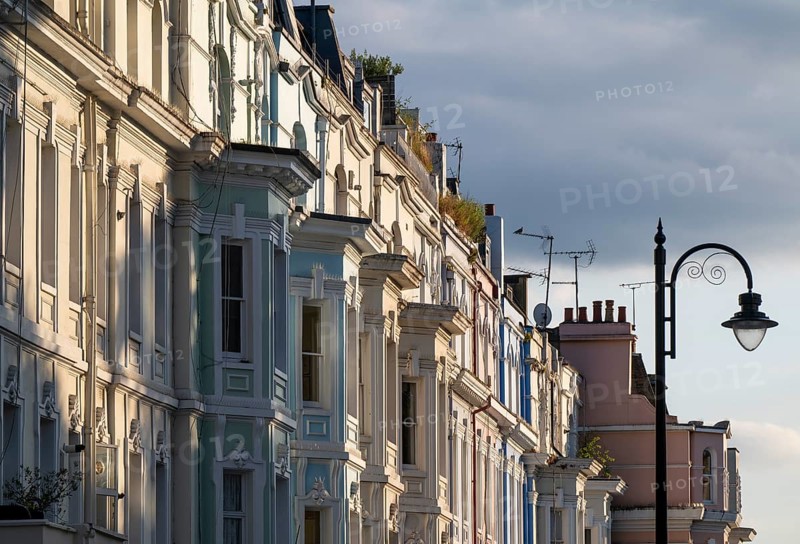 Street lamp, terraced houses, townhouses with different, partly pastel-coloured facades Portobello Road, Notting Hill, London, England, Great Britain