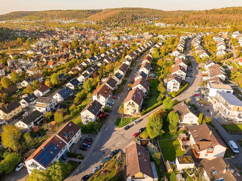 Residential area with terraced houses in a green landscape and hilly surroundings, Nagold, Black Forest, Germany