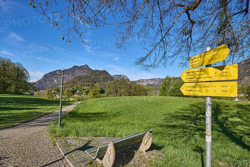 Mountain landscape, mountains, hills, bench, footpath, cobblestones, trees, lawn, signpost to Bayerisch Gmain, Großgmain, Marzoll, Bad Reichenhall, Kibling, fairground, Kirchberg and Karlstein, blue sky, cirrostratus clouds, Pfannhauserweg, Bad Reichenhall, district Berchtesgadener Land, Bavaria, Germany