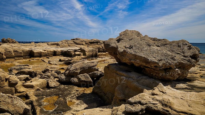 Large rocks along the coast under a clear sky, Oasis Beach, East Coast Rhodes, Rhodes, Dodecanese, Greek Islands, Greece