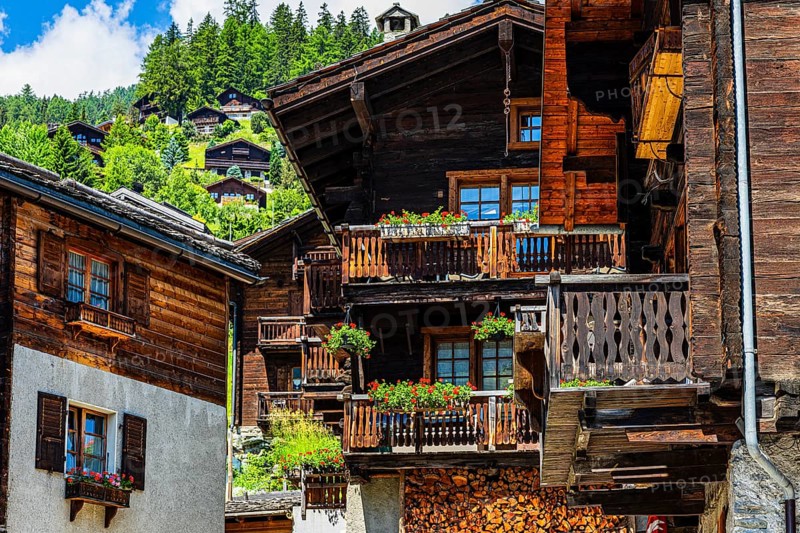 Old wooden houses in log construction, decorated with flowers, historic village centre, Grimentz, Val d'Anniviers, Valais Alps, Canton Valais, Switzerland