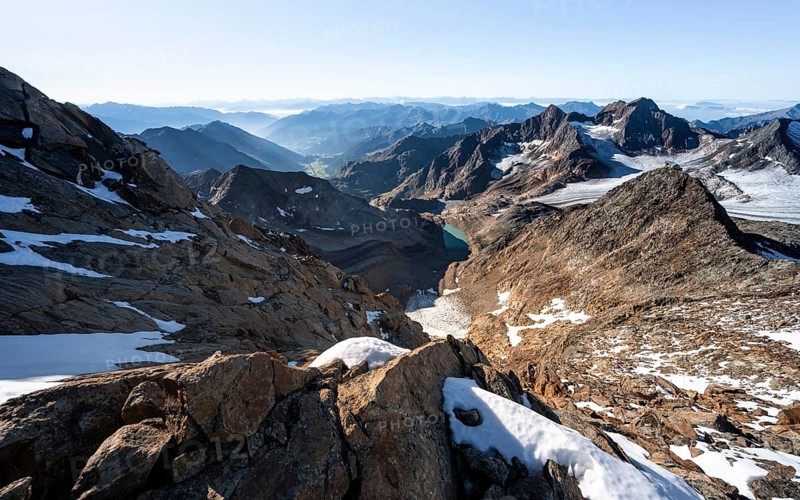 Panoramic view Mountain panorama into the Ridnaun valley, ascent to the Wilder Freiger, summit of the Becher with Becherhaus behind, picturesque high mountain landscape, view of the Übeltalferner glacier and rocky mountain peaks Königshofspitz, Stubai Alps, South Tyrol, Italy