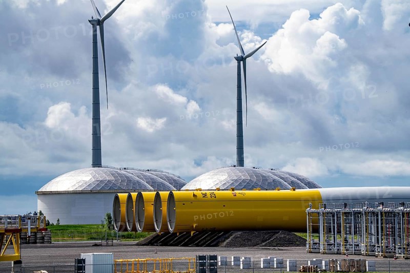 The seaport of Eemshaven, Julianahaven Basin, where the foundation structures, monopiles, for offshore wind farms are stored, which then support the actual wind turbines, the components are transported to the wind farms in the North Sea on large workboats and anchored to the seabed, where the wind turbines are then built, Eemshaven, Netherlands