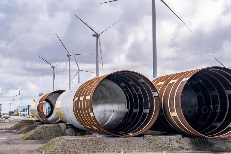 The seaport of Eemshaven, Julianahaven Basin, where the foundation structures, monopiles, for offshore wind farms are stored, which then support the actual wind turbines, the components are transported to the wind farms in the North Sea on large workboats and anchored to the seabed, where the wind turbines are then built, Eemshaven, Netherlands