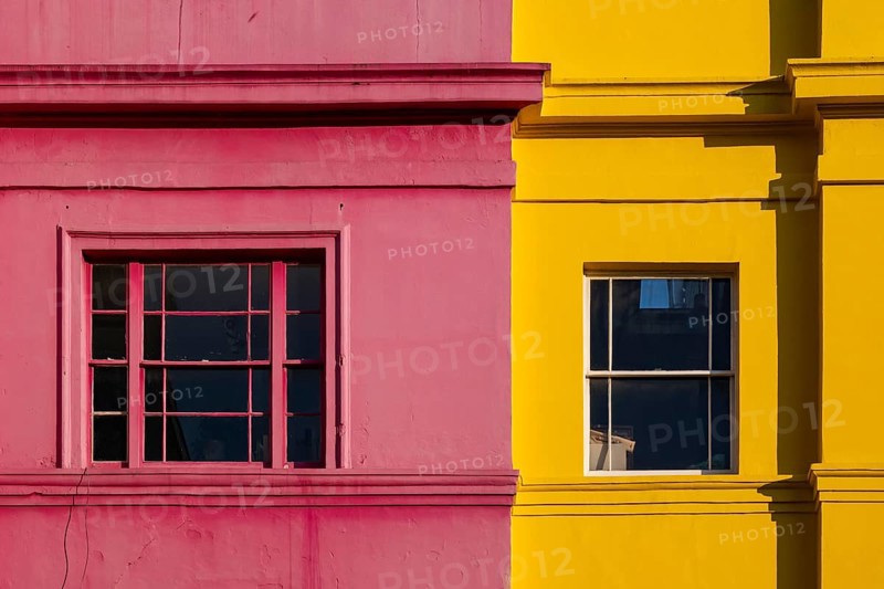 Colourful building facades in pink and yellow, Portobello Road, Notting Hill, London, England, Great Britain