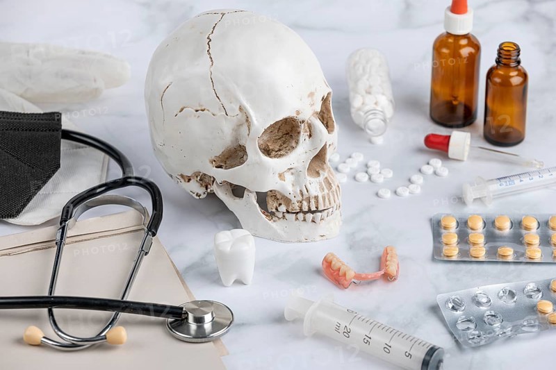 Medical utensils, tablets with skull and teeth