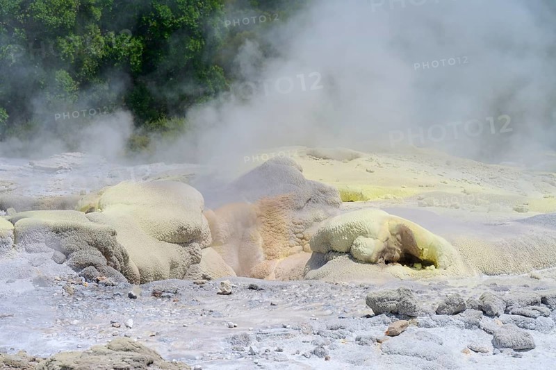 Yellowish sulphur deposits on volcanic formations with rising steam, Te Puia, Whakarewarewa, Rotorua, North Island, New Zealand