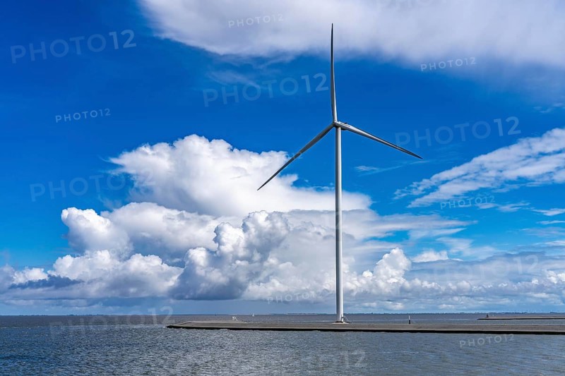 Strekdammen Wind Farm, wind farm at the seaport of Eemshaven in the Netherlands, built on offshore breakwaters, 2 GE Cypress 5, 5 MW turbines, with 158 metre blade diameter, together produce 11 MW of power, can supply 15, 500 households with electricity from wind, cumulus cloud over the North Sea, Netherlands