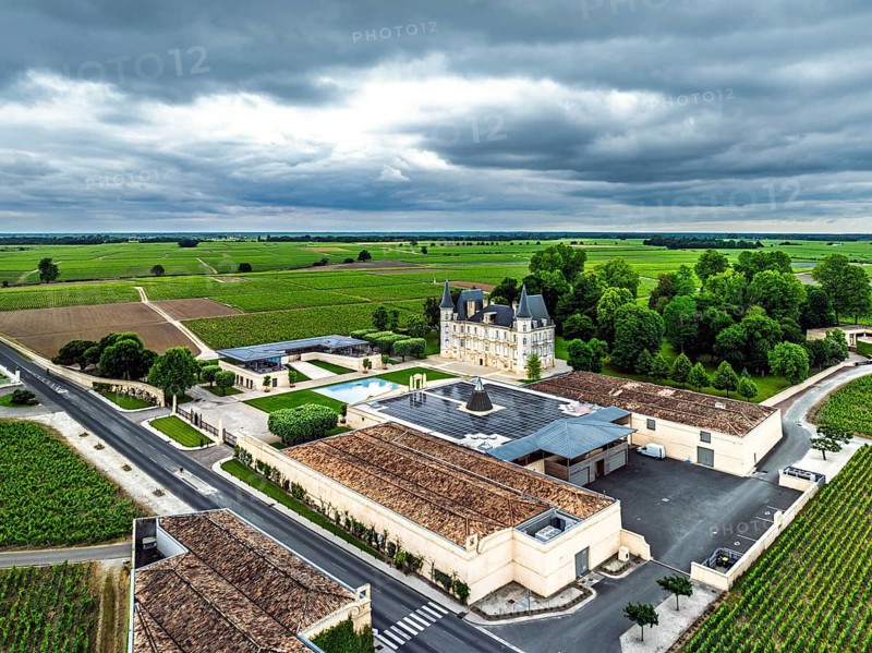 Chateau Pichon Longueville Baron Vineyard and grape fields around Pauillac from a drone, Bordeaux, Gironde, Nouvelle-Aquitaine, France