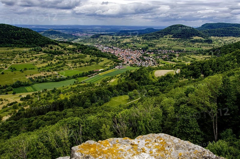 Wide view over the Neidlingen valley with a small village and surrounding hills, Neidlingen